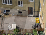 Residential Courtyard With Toys And Bicycles In Munich
