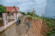 First Day Of School Passing Landslide-affected Road In Jatigede, Indonesia