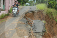 First Day Of School Passing Landslide-affected Road In Jatigede, Indonesia