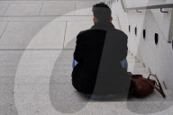 Man Sitting Alone On Concrete Steps
