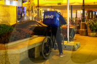 Wolt Food Courier On Bicycle At Night