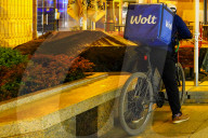 Wolt Food Courier On Bicycle At Night