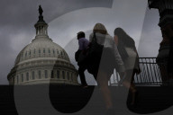 People Walk Past U.S. Capitol
