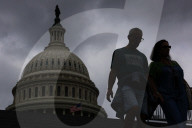 People Walk Past U.S. Capitol