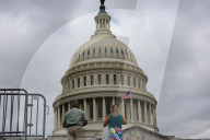 People Walk Past U.S. Capitol