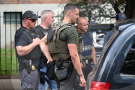 Members Of The United States Marshal Service Regional Fugitive Task Force Gather At The Scene Following The Arrest Of A 62-year-old Man Identified As Audwin Caines On West 142nd Street