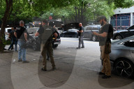 Members Of The United States Marshal Service Regional Fugitive Task Force Gather At The Scene Following The Arrest Of A 62-year-old Man Identified As Audwin Caines On West 142nd Street