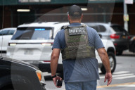 Members Of The United States Marshal Service Regional Fugitive Task Force Gather At The Scene Following The Arrest Of A 62-year-old Man Identified As Audwin Caines On West 142nd Street