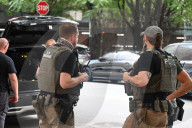 Members Of The United States Marshal Service Regional Fugitive Task Force Gather At The Scene Following The Arrest Of A 62-year-old Man Identified As Audwin Caines On West 142nd Street