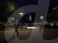 Man Passes Metro Entrance At Night