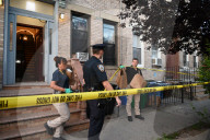 Evidence Is Collected And A Memorial Is Held Following A Tragedy Where A Man Stabbed His Wife And Two-year-old Daughter To Death And Wounds Himself In A Domestic Related Murder-suicide Attack At 63-35 Forest Avenue