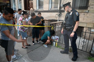 Evidence Is Collected And A Memorial Is Held Following A Tragedy Where A Man Stabbed His Wife And Two-year-old Daughter To Death And Wounds Himself In A Domestic Related Murder-suicide Attack At 63-35 Forest Avenue