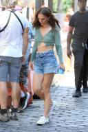 Natalie Portman is summer chic in green cashmere cropped sweater, cut-off jean short and white shoes film 'Good Sex' in New York City