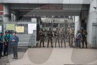Armed Forces Guard Burn Hospital After Plane Crash