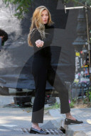 Sarah Pidgeon is spotted in a black sweater and pants with loafers filming 'American Love Story' in East Village in New York City