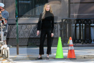Sarah Pidgeon is spotted in a black sweater and pants with loafers filming 'American Love Story' in East Village in New York City