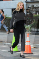 Sarah Pidgeon is spotted in a black sweater and pants with loafers filming 'American Love Story' in East Village in New York City