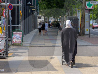 Woman Walking With Trolley In Berlin