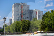 Man Sunbathing On Bridge Structure