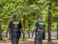 Police Patrol Opposite Holocaust Memorial In Berlin