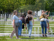 Tourists Cool Off At Fountain Near German Chancellery