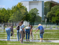 Tourists Cool Off At Fountain Near German Chancellery