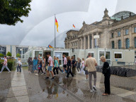 Tourist Groups Visit The Reichstag On A Rainy Day
