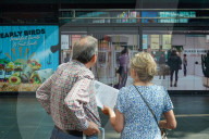 Travelers Check Train Departures At Berlin Main Station