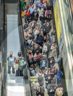Crowds Of Travelers At Berlin Main Station Escalator Area