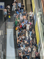 Crowds Of Travelers At Berlin Main Station Escalator Area