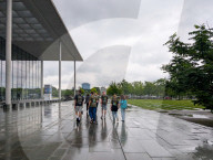 Youth Group Tour In Berlin Government District On Rainy Summer Day