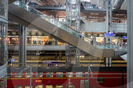 Berlin Main Station With Regional Train And Travelers