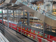 Berlin Main Station With Regional Train And Travelers