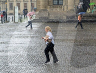 Woman Runs Through Heavy Rain