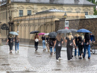 Group Walking In Rain