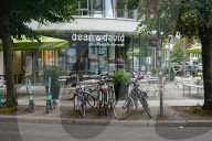 Dean And David Restaurant Front With Bicycles And Scooters