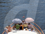 Boat Cruise With Large Umbrellas On A Hot Day In Berlin