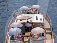Boat Cruise With Large Umbrellas On A Hot Day In Berlin
