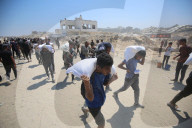 Gazans endure long walks to trucks carrying humanitarian aid