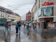 Shoppers In The Rain At A S.Oliver Store