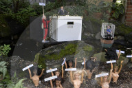 DC: DC resident hold a Epstein’s file flash mock