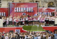 The England women's national football team celebrate with thousands of fans on The Mall outside Buckingham Palace