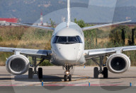 Diverse aircraft on the takeoff runway at Barcelona Airport