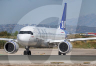 Diverse aircraft on the takeoff runway at Barcelona Airport