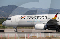 Diverse aircraft on the takeoff runway at Barcelona Airport