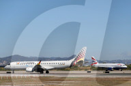 Diverse aircraft on the takeoff runway at Barcelona Airport