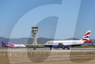 Diverse aircraft on the takeoff runway at Barcelona Airport