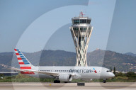 Diverse aircraft on the takeoff runway at Barcelona Airport