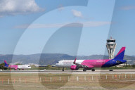 Diverse aircraft on the takeoff runway at Barcelona Airport