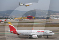 Diverse aircraft on the takeoff runway at Barcelon aAirport